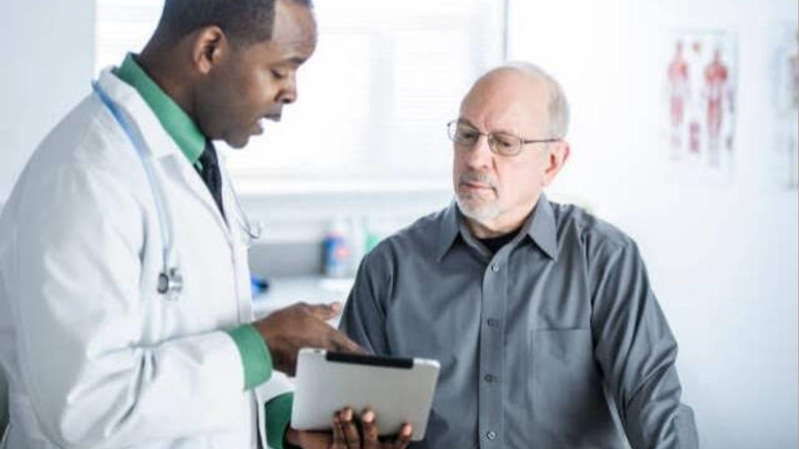 Man consulting doctor.