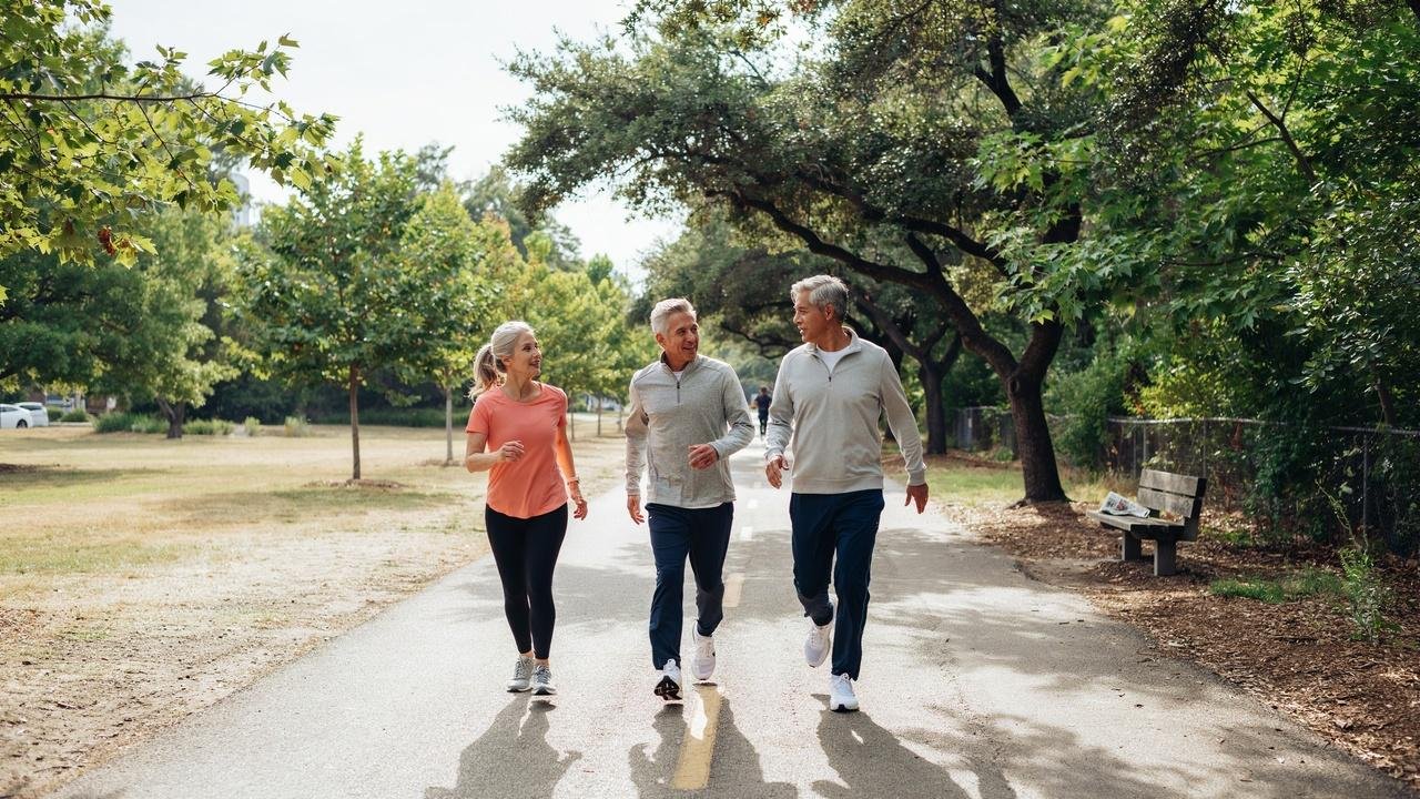 Senior couple enjoying a brisk walk as a simple aerobic exercise.