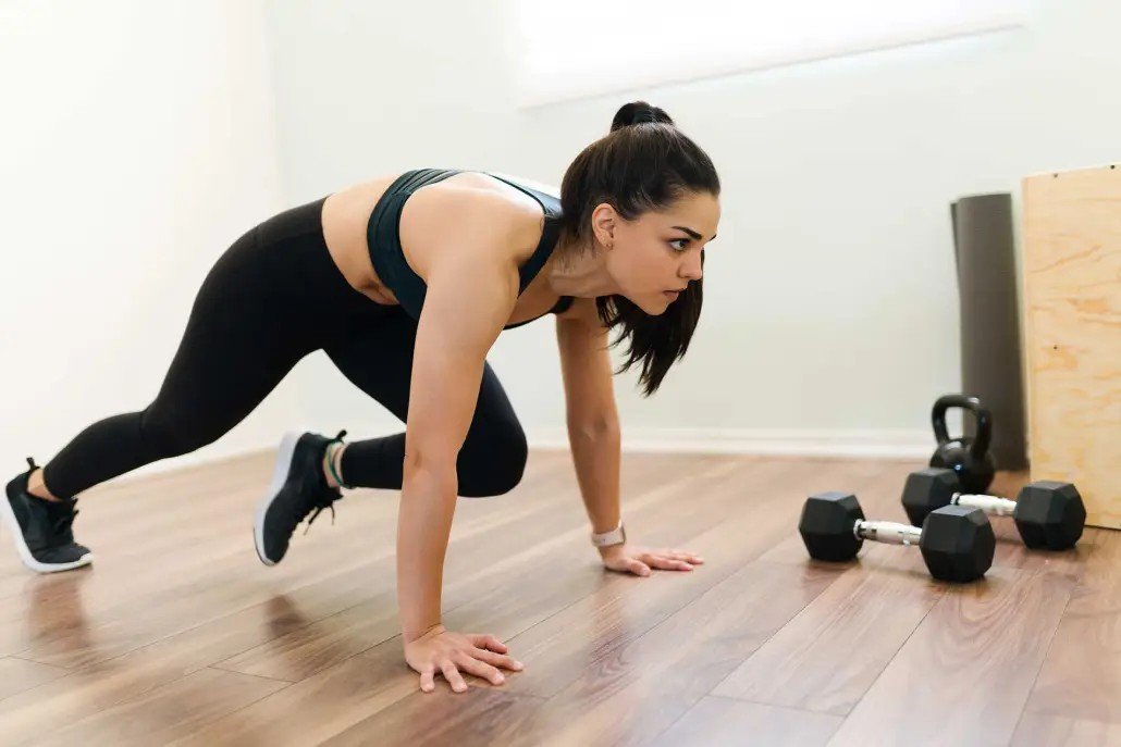 Woman performing HIIT Pilates