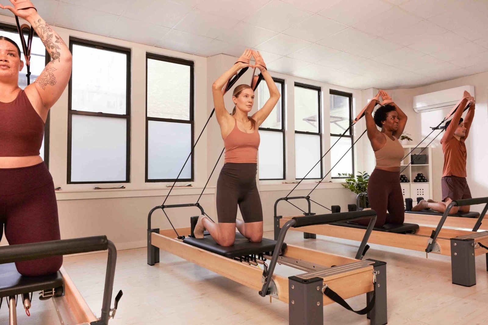 Women performing contemporary pilates