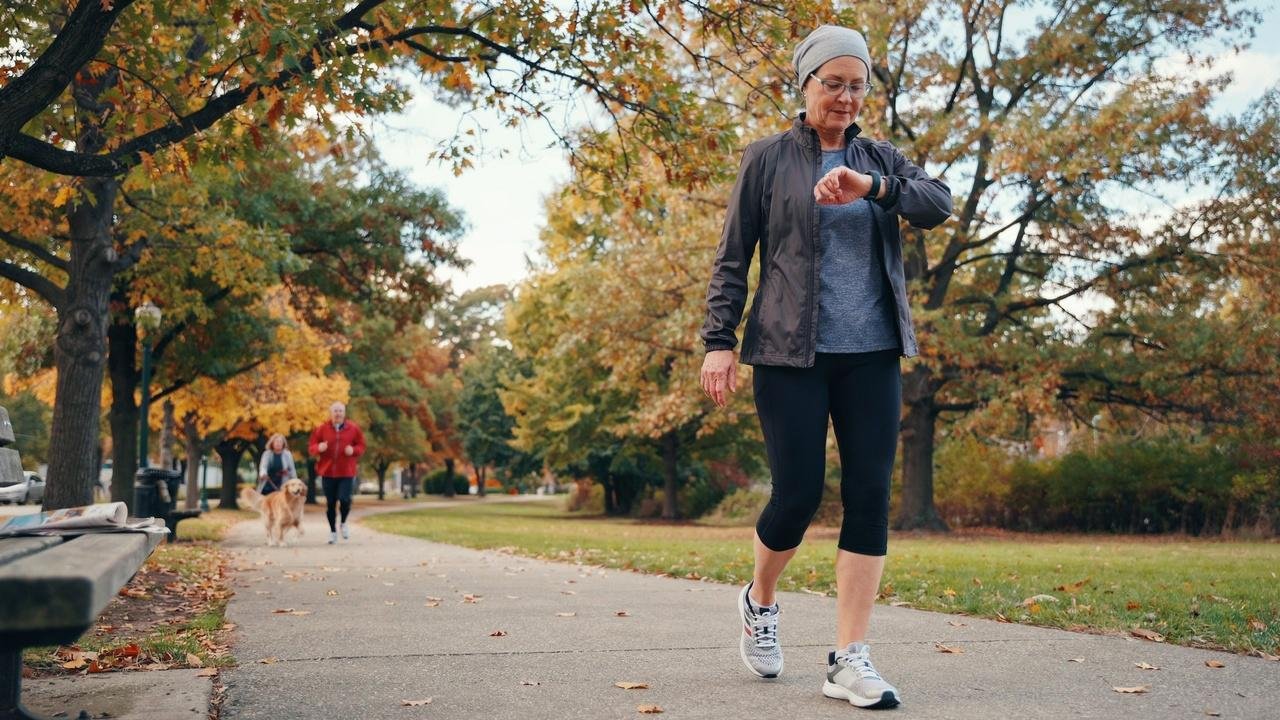 Senior tracking weekly aerobic exercise during a walk.