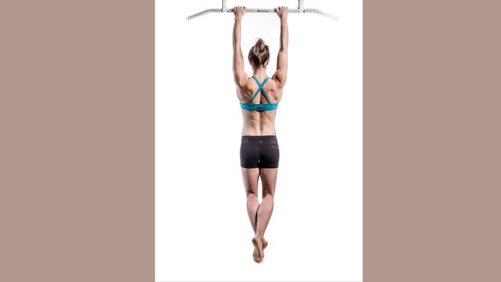 Woman doing pull ups.
